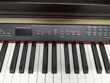 Load image into Gallery viewer, Yamaha Clavinova CLP-130 Digital Piano and stool in dark rosewood stock #23185