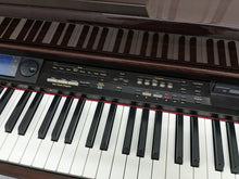 Load image into Gallery viewer, Roland KR-575 Intelligent Digital Piano / arranger glossy mahogany stock # 23194