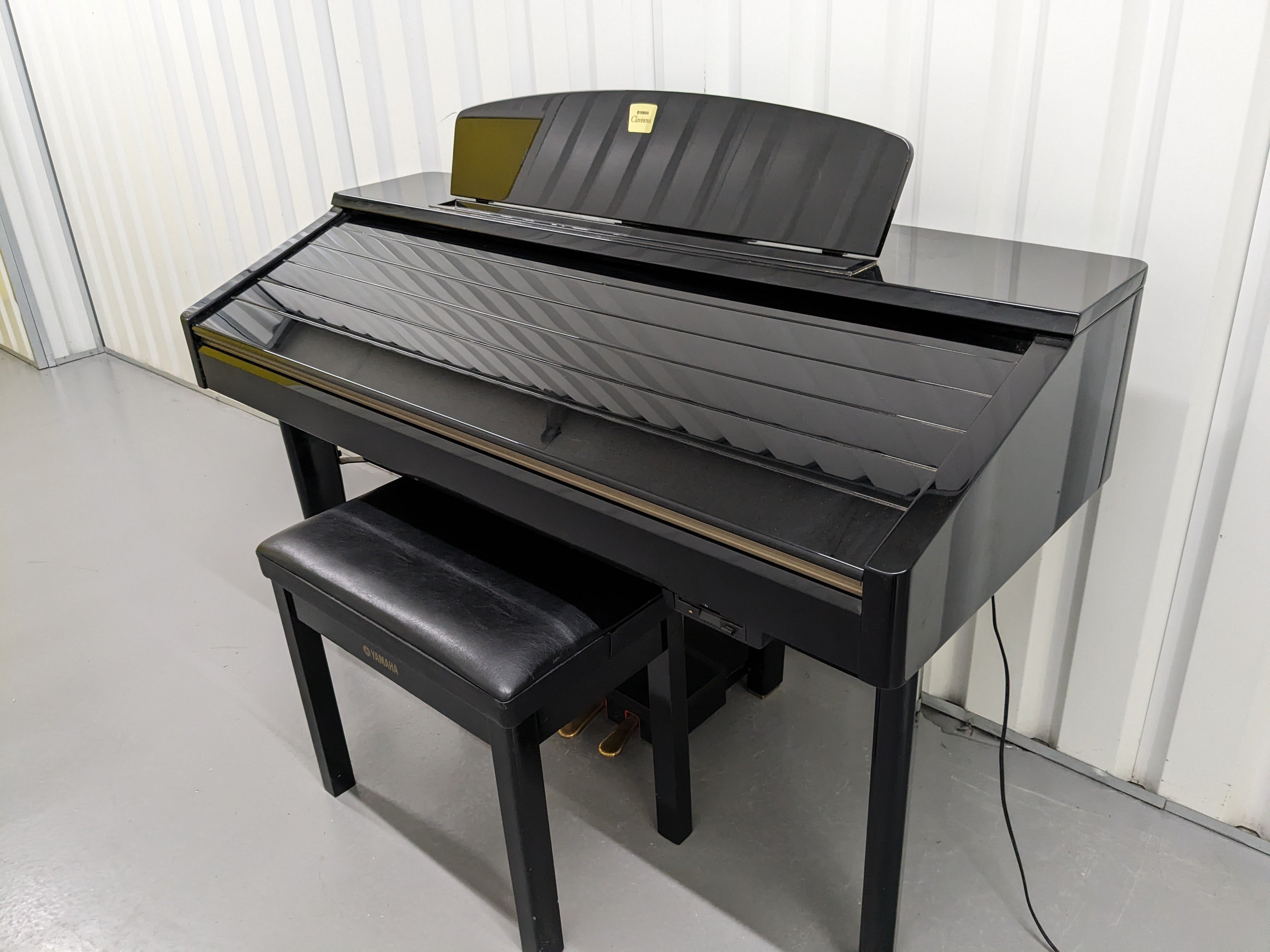 Yamaha Clavinova CVP-209 in Polished Ebony with matching stool. stock –  Sulinda Music