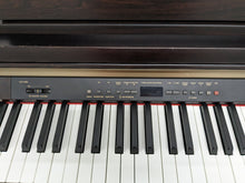 Load image into Gallery viewer, Yamaha Clavinova CLP-930 Digital Piano in dark rosewood stock #23373