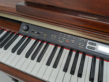 Load image into Gallery viewer, Yamaha Clavinova CLP-150 Digital Piano and stool in mahogany colour stock #23411
