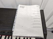 Load image into Gallery viewer, Roland RP401R digital piano and stool in dar rosewood finish stock number 23423