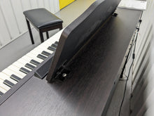 Load image into Gallery viewer, Roland RP401R digital piano and stool in dar rosewood finish stock number 23450