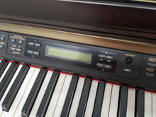 Load image into Gallery viewer, Yamaha Clavinova CLP-150 Digital Piano and stool in dark rosewood stock #23460