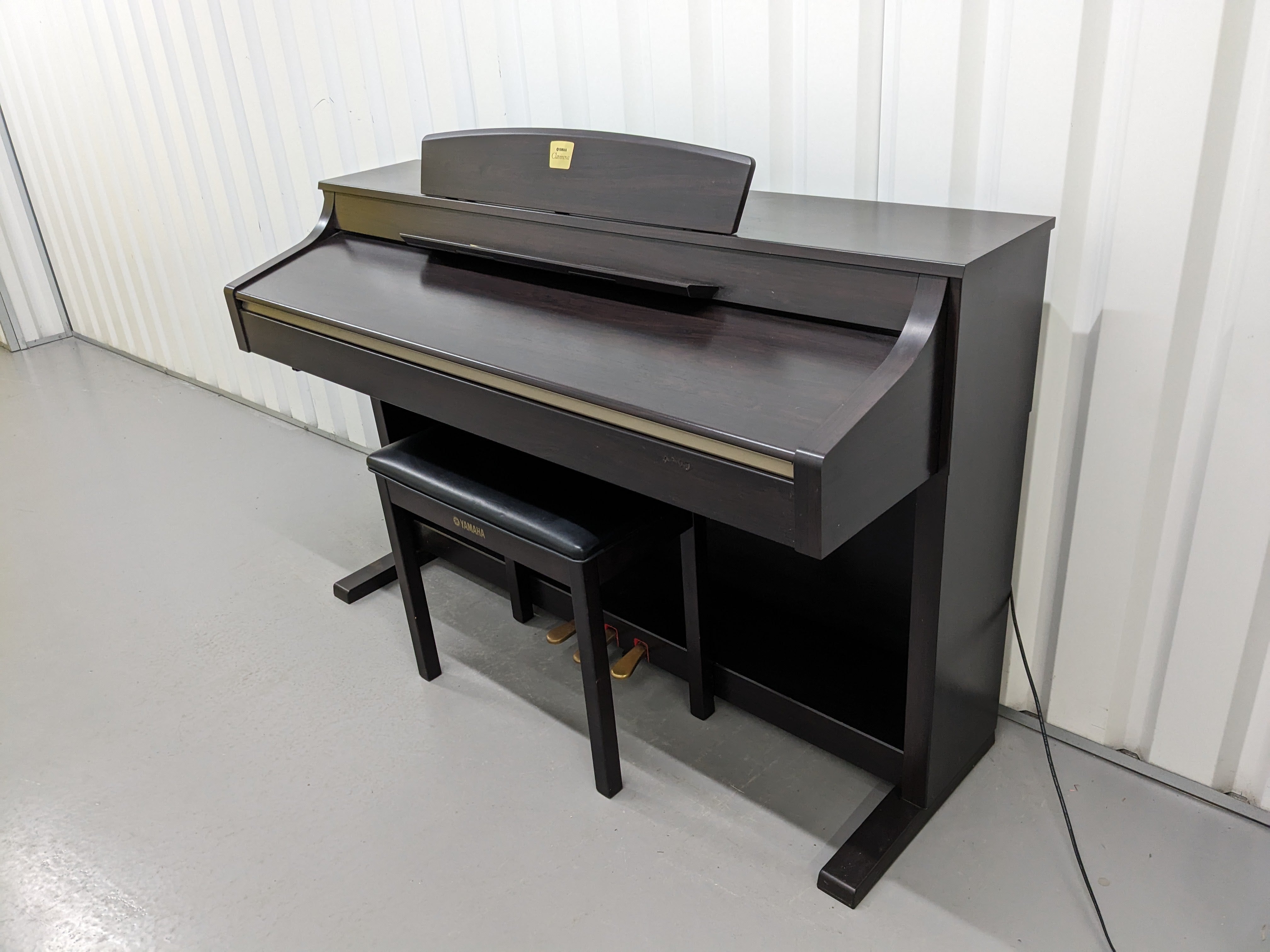 Yamaha Clavinova CLP-340 Digital Piano and stool in dark