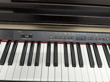 Load image into Gallery viewer, Yamaha Clavinova CLP-930 Digital Piano in dark rosewood stock #23494