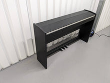 Load image into Gallery viewer, Roland F130R Digital Piano in black with matching colour stool stock # 23495