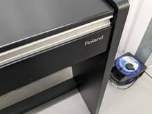 Load image into Gallery viewer, Roland F130R Digital Piano in black with matching colour stool stock # 23495