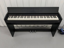 Load image into Gallery viewer, Roland F130R Digital Piano in black with matching colour stool stock # 23495
