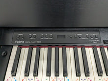 Load image into Gallery viewer, Roland F130R Digital Piano in black with matching colour stool stock # 23495
