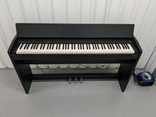 Load image into Gallery viewer, Roland F130R Digital Piano in black with matching colour stool stock # 23495