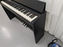 Load image into Gallery viewer, Roland F130R Digital Piano in black with matching colour stool stock # 23495