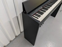 Load image into Gallery viewer, Roland F130R Digital Piano in black with matching colour stool stock # 23495