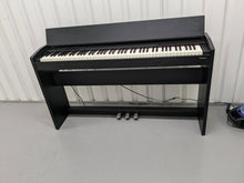 Load image into Gallery viewer, Roland F130R Digital Piano in black with matching colour stool stock # 23495