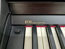 Load image into Gallery viewer, Roland RP301 digital piano and stool in satin black finish stock number 23508