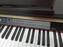 Load image into Gallery viewer, Yamaha Clavinova CLP-150 Digital Piano and stool in dark rosewood stock #24028