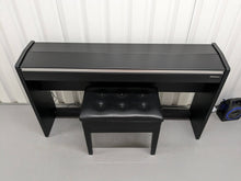 Load image into Gallery viewer, Roland F140R Digital Piano in black with matching colour stool stock # 24063
