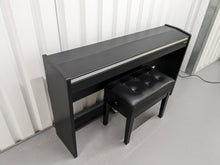 Load image into Gallery viewer, Roland F140R Digital Piano in black with matching colour stool stock # 24063