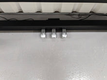 Load image into Gallery viewer, Roland F140R Digital Piano in black with matching colour stool stock # 24063
