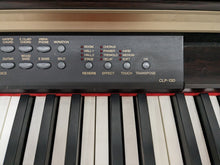 Load image into Gallery viewer, Yamaha Clavinova CLP-130 Digital Piano in dark rosewood stock #24103