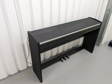 Load image into Gallery viewer, Roland F-110 compact slim size Digital Piano in black stock # 24126