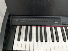 Load image into Gallery viewer, Roland F-110 compact slim size Digital Piano in black stock # 24126