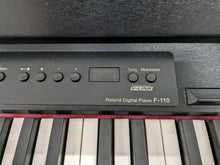 Load image into Gallery viewer, Roland F-110 compact slim size Digital Piano in black stock # 24126