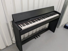 Load image into Gallery viewer, Roland F-110 compact slim size Digital Piano in black stock # 24126