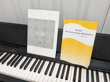 Load image into Gallery viewer, Roland F-110 compact slim size Digital Piano in black stock # 24126