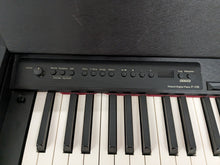 Load image into Gallery viewer, Roland F-110 compact slim size Digital Piano in black stock # 24129