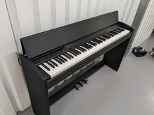 Load image into Gallery viewer, Roland F-110 compact slim size Digital Piano in black stock # 24129