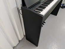 Load image into Gallery viewer, Roland F-110 compact slim size Digital Piano in black stock # 24129
