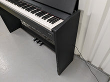 Load image into Gallery viewer, Roland F-110 compact slim size Digital Piano in black stock # 24129