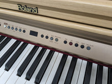 Load image into Gallery viewer, Roland HP102e digital piano and stool in light oak finish stock number 24134