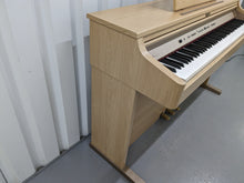 Load image into Gallery viewer, Roland HP102e digital piano and stool in light oak finish stock number 24134