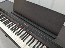 Load image into Gallery viewer, Roland RP301 digital piano in dark rosewood finish stock number 24209