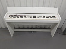 Load image into Gallery viewer, Roland F140R Digital Piano in satin white slim line space saver stock # 24246