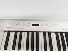 Load image into Gallery viewer, Roland F140R Digital Piano in satin white slim line space saver stock # 24246