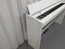 Load image into Gallery viewer, Roland F140R Digital Piano in satin white slim line space saver stock # 24246