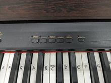 Load image into Gallery viewer, Yamaha Clavinova CLP-820 Digital Piano in dark rosewood stock nr 24250