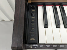 Load image into Gallery viewer, Roland HP101e Digital Piano in rosewood weighted keys 3 pedals, stock # 24264