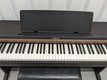 Load image into Gallery viewer, Roland HP101e Digital Piano in rosewood weighted keys 3 pedals, stock # 24264