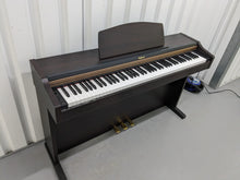 Load image into Gallery viewer, Roland HP101e Digital Piano in rosewood weighted keys 3 pedals, stock # 24272