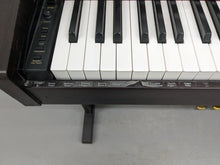 Load image into Gallery viewer, Roland HP101e Digital Piano in rosewood weighted keys 3 pedals, stock # 24272