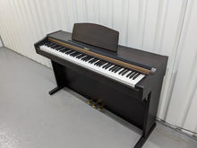 Load image into Gallery viewer, Roland HP101e Digital Piano in rosewood weighted keys 3 pedals, stock # 24272