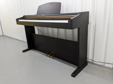 Load image into Gallery viewer, Roland HP101e Digital Piano in rosewood weighted keys 3 pedals, stock # 24272