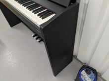Load image into Gallery viewer, Roland F120R compact slim size Digital Piano and stool in black stock # 24279