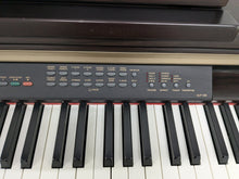 Load image into Gallery viewer, Yamaha Clavinova CLP-130 Digital Piano in dark rosewood stock #24358