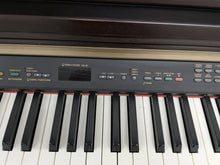 Load image into Gallery viewer, Yamaha Clavinova CLP-130 Digital Piano in dark rosewood stock #24358