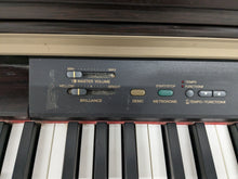 Load image into Gallery viewer, Yamaha Clavinova CLP-130 Digital Piano in dark rosewood stock #24358